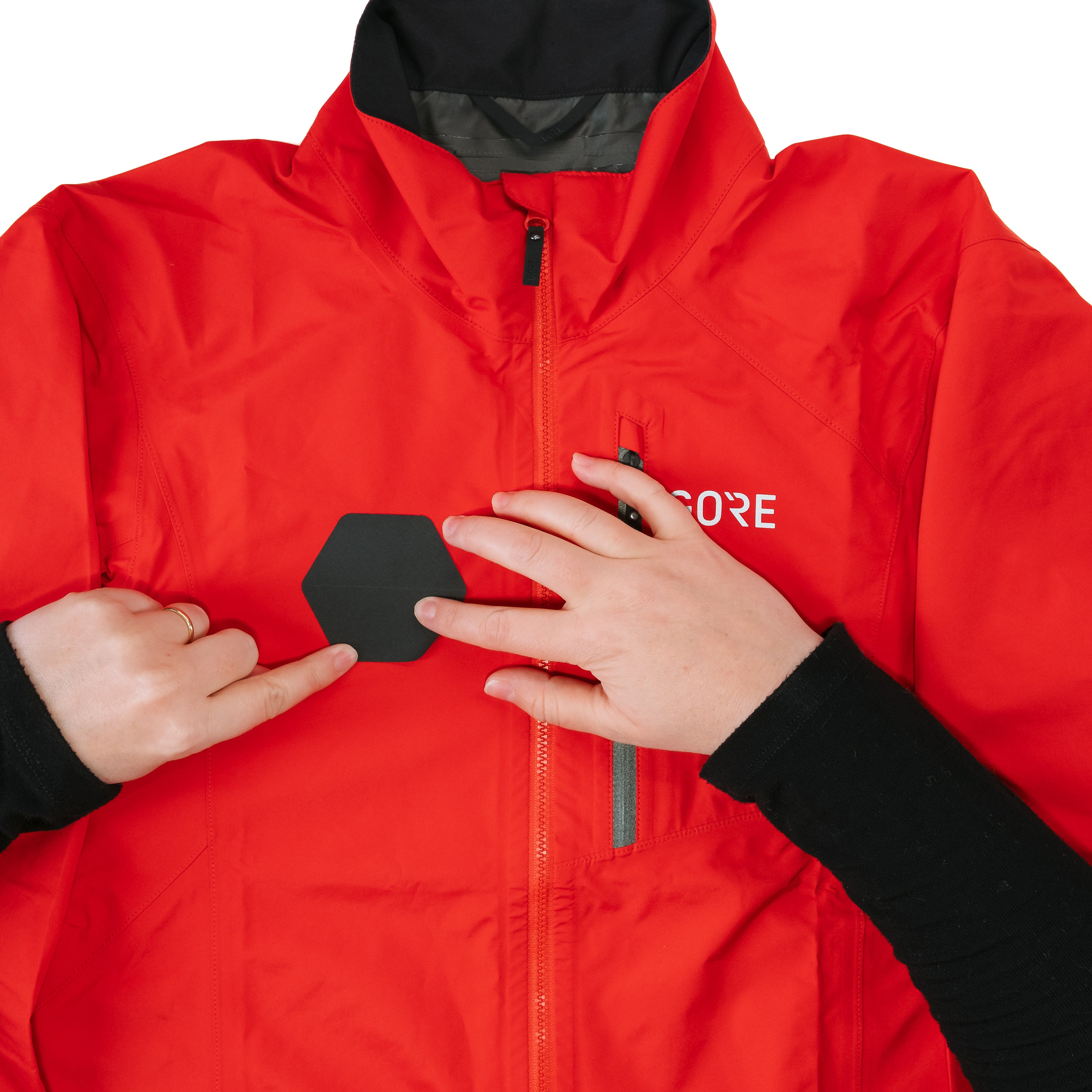 Red jacket with a brand logo on a white background