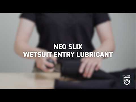Person handling a wetsuit on a table with large text reading, “Neo Slix Wetsuit Entry Lubricant.”