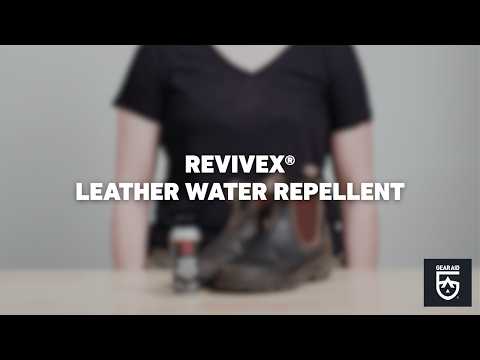 Blurred video cover showing a pair of leather boots displayed beside a bottle of treatment product, with the title “REVIVEX® LEATHER WATER REPELLENT” centered and the Gear Aid logo in the bottom-right corner.