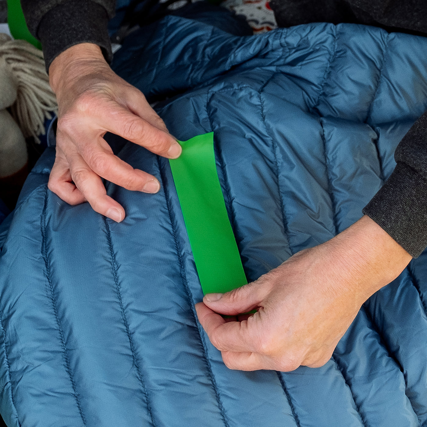 Where can I get dark blue tenacious tape or another alternative to repair  this jacket? : r/CampingGear