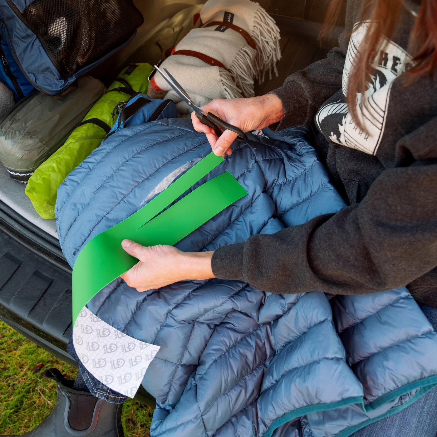Washing a down sleeping bag with a duct tape patch - Backpacking Light