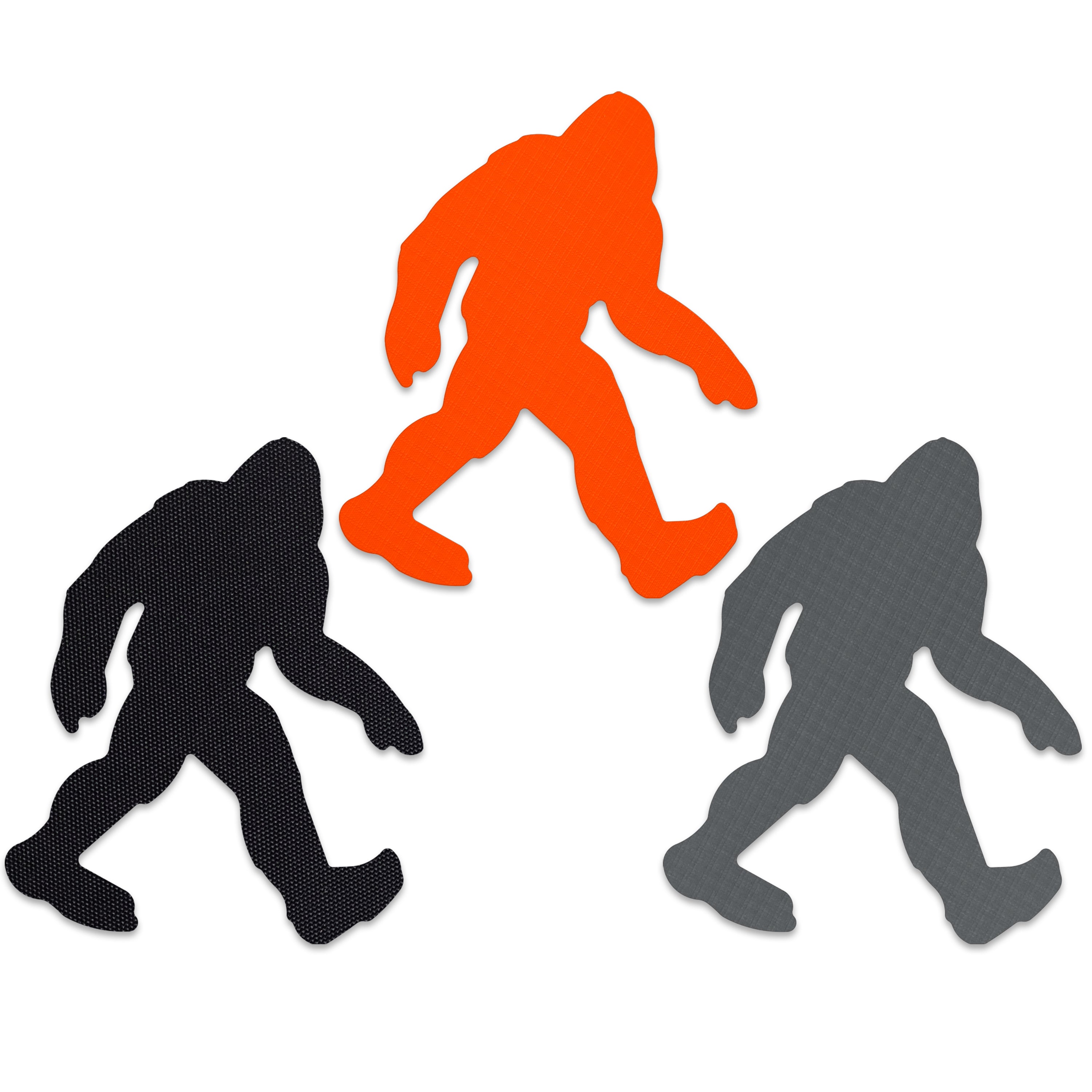 Three Bigfoot repair patches in orange, black, and gray on a white background.