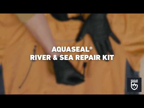 Blurred video cover showing gloved hands repairing orange waterproof gear on a work surface, with the title “AQUASEAL® RIVER & SEA REPAIR KIT” centered and the Gear Aid logo in the bottom-right corner.