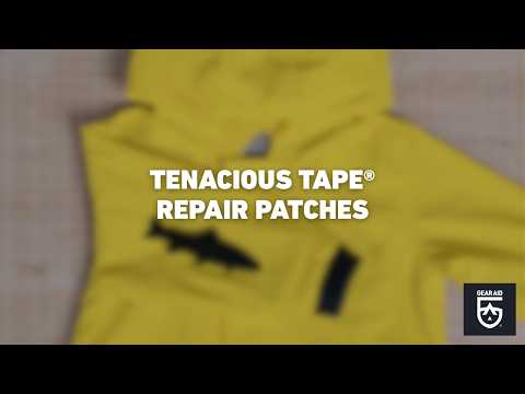 Blurred video cover showing a yellow jacket with black repair patches applied to the fabric, with the title “TENACIOUS TAPE® REPAIR PATCHES” centered and the Gear Aid logo in the bottom-right corner.